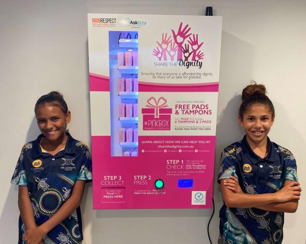 Students with a Dignity Vending Machine